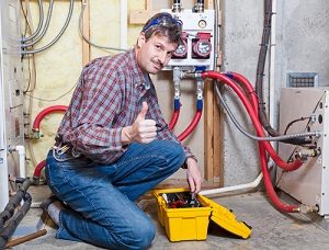 HVAC contractor maintaining furnace