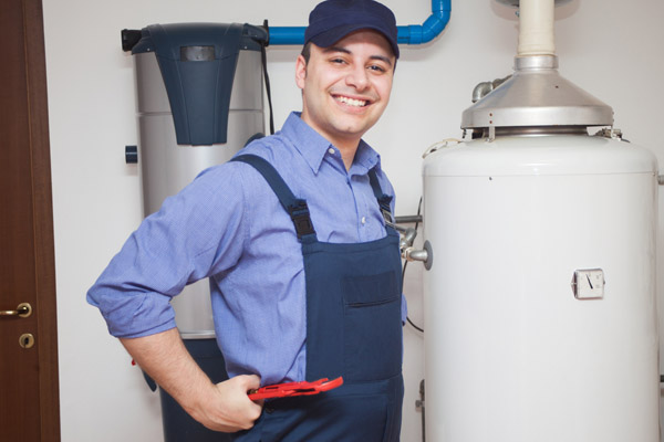 image of a plumber with a hot water heater
