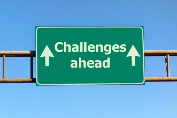 challenges ahead road sign depicting air conditioner replacement