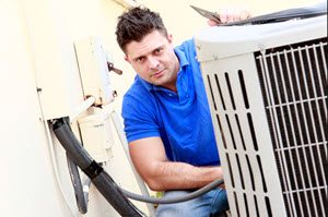 image of HVAC contractor installing air conditioning system