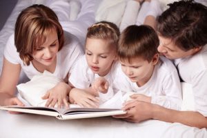 happy family reading a book