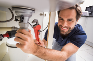 plumber fixing sink