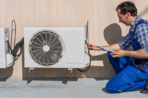 hvac contractor installing a ductless heat pump