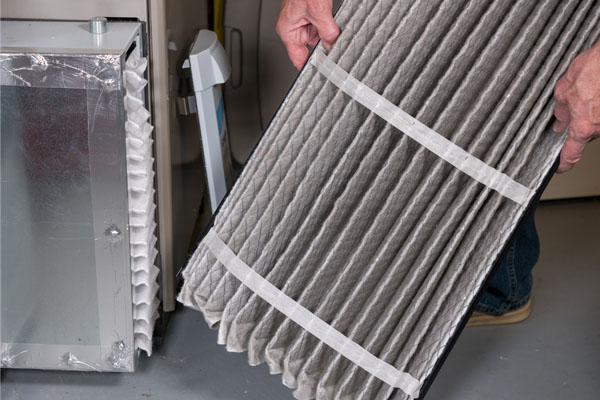 image of an oil-fired furnace filter replacement