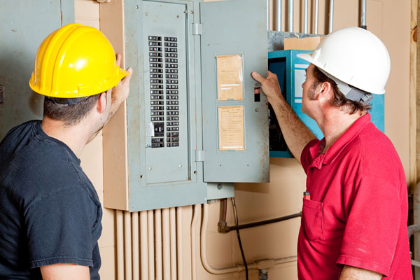 hvac technicians updating circuit breaker for ductless install
