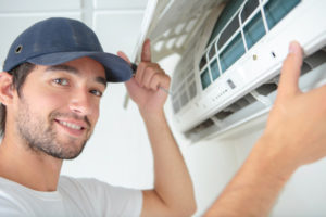 image of an hvac contractor installing a ductless mini-split system