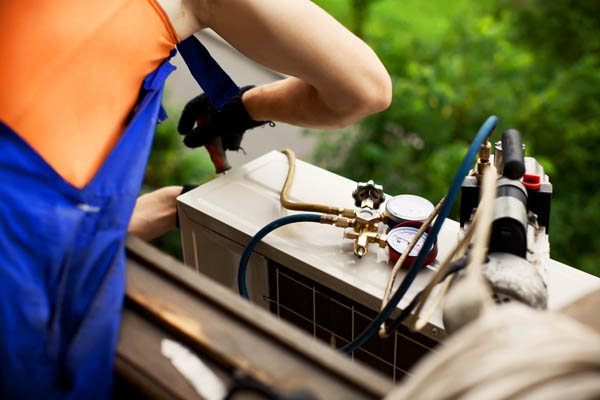 image of an hvac contractor sizing a ductless air conditioner