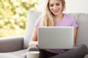 woman on computer looking at hvac contractor reviews