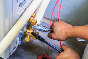 hvac contractor preparing to install new air conditioner