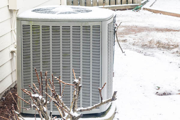 image of an air conditioner in the snow depicting ac replacement