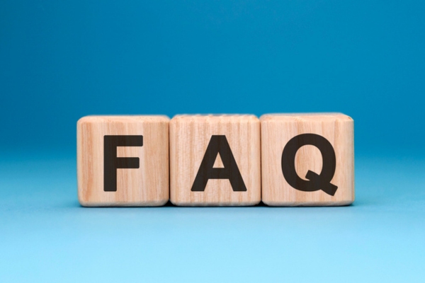 FAQ spelled using wooden letter cubes depicting Air Conditioner Sizing questions