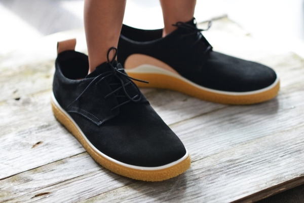 little boy wearing big shoes depicting oversized air conditioner