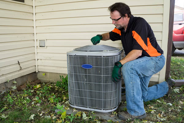 image of HVAC contractor performing air conditioner repair