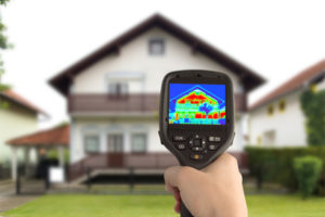image of hvac contractor with air leak detector tool