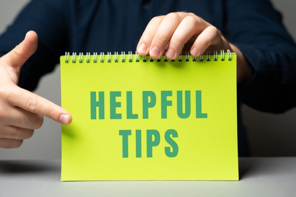 helpful tips written on a notebook to avoid air conditioner making noise