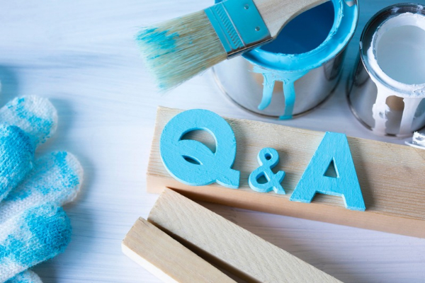 Q & A carved and painted on wood depicting Heating System Repair vs Replace FAQs