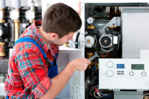 hvac technician installaing heating boiler in raritan nj