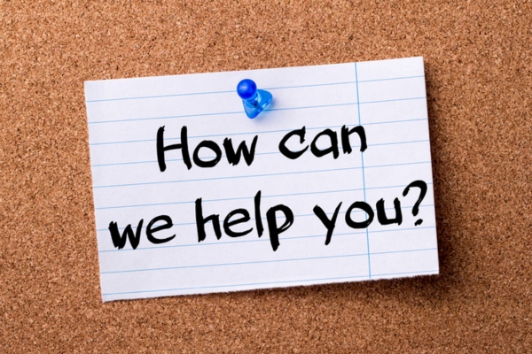 how can we help you note pinned on a corkboard