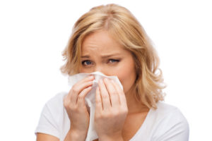 image of a homeowner experiencing allergies