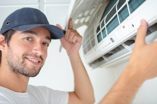 image of an hvac contractor inspecting an old hvac system