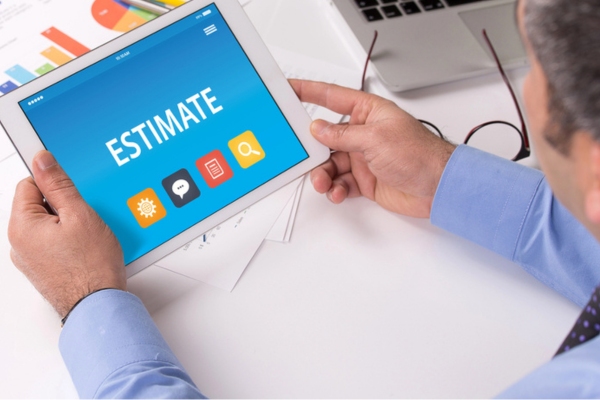 man looking at a smart tablet that says estimate on display depicting Power Requirements of Your Home