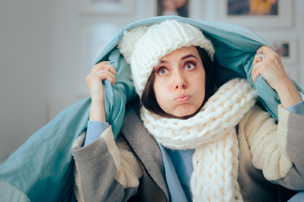 image of a homeowner during power outage and gas furnace