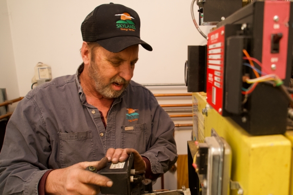 Skylands Energy Service HVAC technician tending to a boiler system
