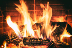 image of a fireplace chimney and money depicting fireplace efficiency