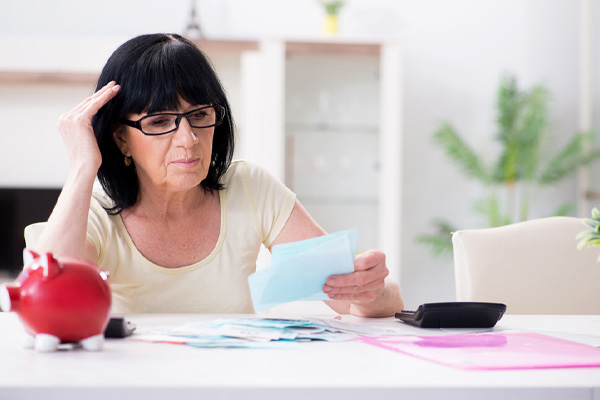 image of a homeowner calculating higher fuel costs of whole house generator