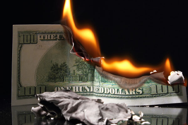 image of burning money depicting fireplace inefficiency