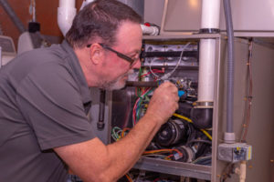 image of a furnace and hvac technician