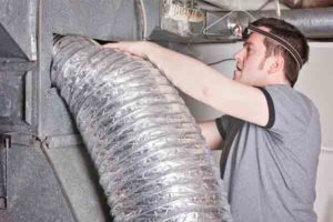 image of an hvac contractor with hvac ducts