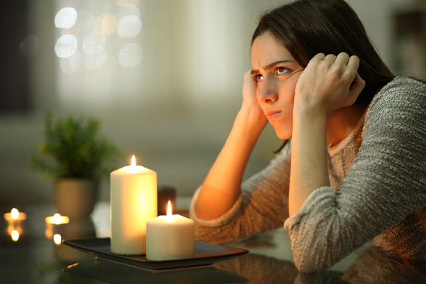 image of a homeowner during power outage because standby generator failed to start