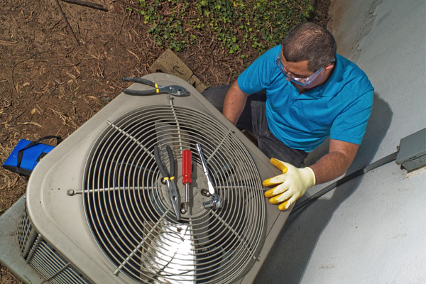 hvac contractor servicing air conditioner