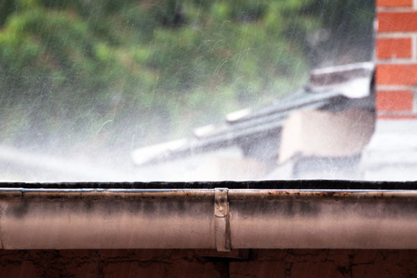 rain depicting water collecting in air conditioner condenser