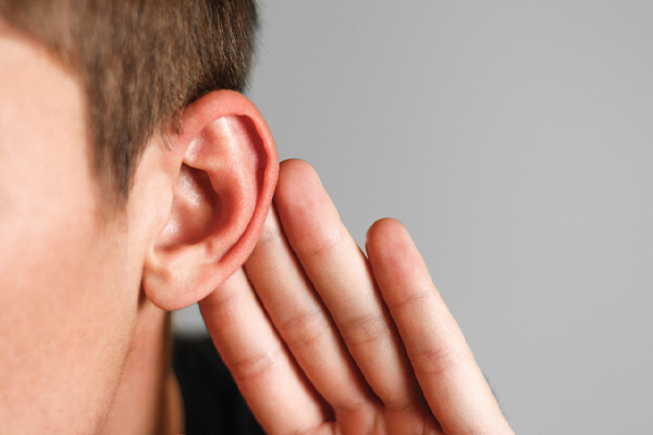 cupping ear depicting air conditioner noises