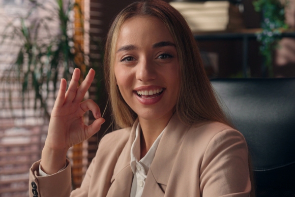 woman doing an okay sign depicting confidence in cooling system