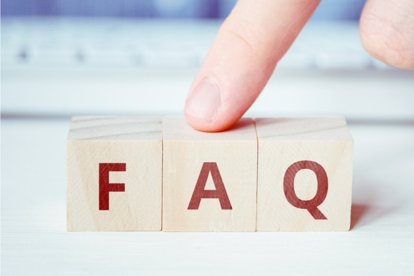 FAQ spelled using wooden letter cubes depicting HVAC Maintenance Agreement questions