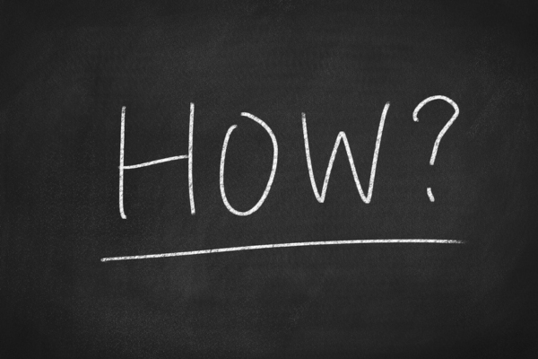 HOW word written on a chalkboard