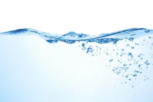 image of water with bubbles depicting role of water in boiler system