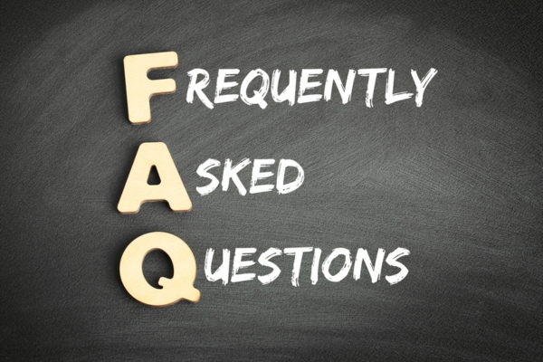Frequently Asked Questions on a chalkboard depicting FAQs about Ductless Heat Pumps vs Ductless Air Conditioners
