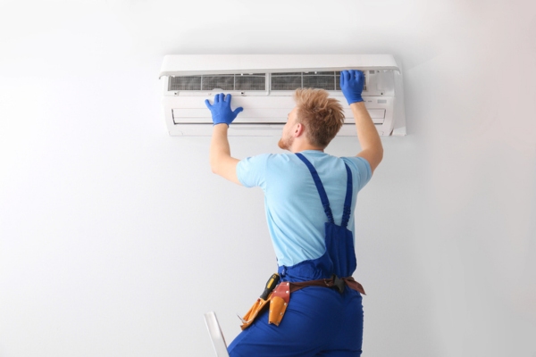 HVAC technician and a ductless air conditioner