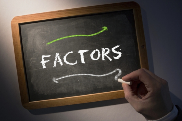 Factors written on mini chalkboard depicting Choosing Home Air Conditioning Systems