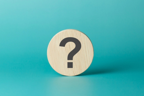 wooden sphere with question mark depicting FAQs about Ductless HVAC vs. Window Cooling Systems