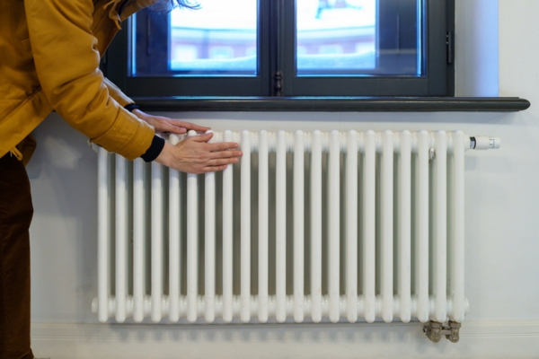 homeowner getting home radiator ready for bleeding
