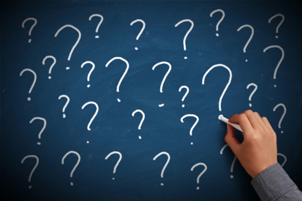 Question marks on a chalkboard depicting FAQs about Whole-House Generator Safety