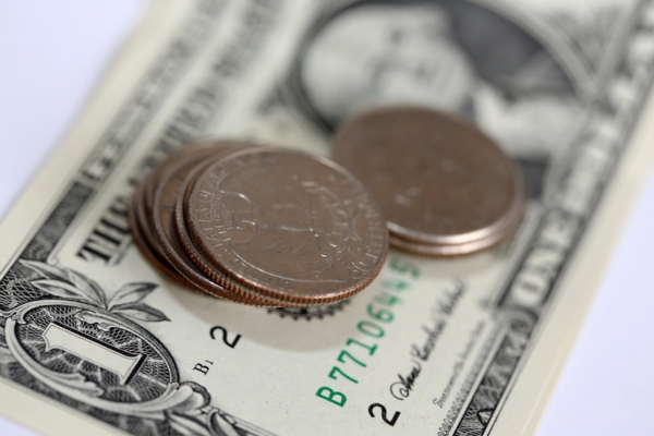 coins and bill depicting heating oil price changes