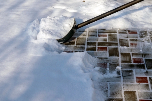 shoveling snow to Maintain Clear Intake and Exhaust Areas for Generator