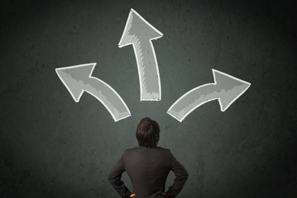 man deciding with arrows above his head depicting Choosing an Energy-Efficient Heating System