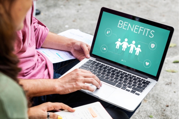 BENEFITS word displayed on a laptop screen depicting Proper Insulation